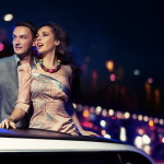 Elegant couple traveling a limousine at night